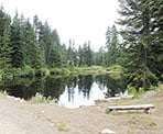 A view across First Lake with the new Hollyburn lodge between the trees