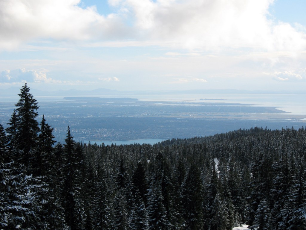A view of Kitsilano and Richmond in the distance from the snowshoe trail of Hollyburn Mountain