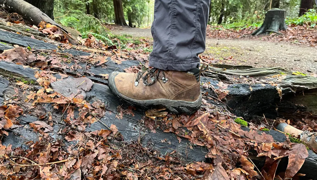 Hiking Boots Stepping on a Log