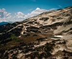 The view of the meadows and Blackcomb Lake surrounded by the beautiful mountains