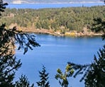 A view can barely be seen of St. Mary Lake on from the South Channel Ridge Trail