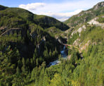 A view of the Cheakamus Canyon and train bridge below along the Sea To Sky Trail