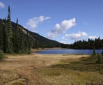 A view of Conflict Lake from the grassy clearing on the far end