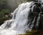 A view of Crooked Falls, with lots of water cascading over the rocks