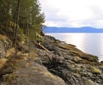 The rocky shoreline looking out to the Strait of Georgia near Francis Bay