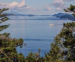 A view of a ferry from the top of George Hill on Pender Island