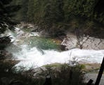 A view looking down onto the falls from the trail above