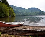 A canoe rests along the shore of Hicks Lake in Sasquatch Provincial Park near Harrison