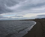 The waves of Georgia Strait hit the shores of Iona Beach