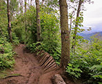 One of the mountain biking obstacles and a view on the Ledgeview Trail