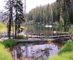 A canoe enters the narrow channel between the two sections of Lightning Lake