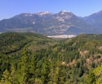 A viewpoint on Mount Crumpit that looks across towards the town of Squamish and mountains to the west