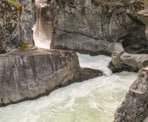 A view of the rock formation and the rushing water at Nairn Falls
