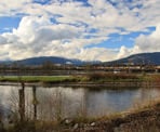 A view across the Pitt River of the distant mountains