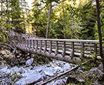 The wooden bridge crossing 21 Mile Creek above Rainbow Falls in Whistler
