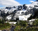 Snow still covers Rainbow Mountain into the summer months