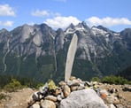 A propeller and other debris from the airplane crash on Mount Slesse stands at the top of the Propeller Cairn