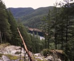 Emerging onto the rock next to the top of Swan Falls looking at the view towards Buntzen Lake